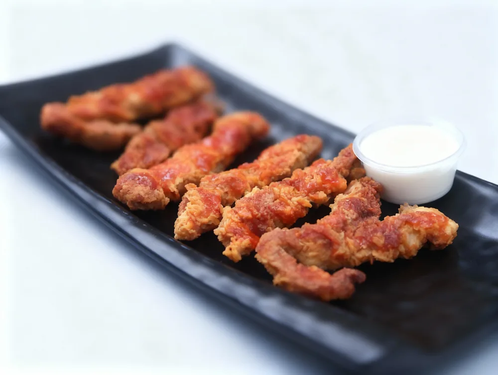Crispy zinger chicken strips with a mayo dip